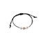 Bracciale Dadini bimba oro e argento cordino nero
